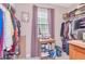 Walk-in closet with ample storage space and natural light at 9317 Stone River Pl, Riverview, FL 33578