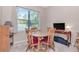 Dining area with natural light and wood furniture at 9317 Stone River Pl, Riverview, FL 33578