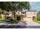 Exterior elevation of townhomes with private garages, neat landscaping, and inviting curb appeal at 9317 Stone River Pl, Riverview, FL 33578