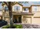 Charming two-story home with blue shutters and a well-maintained brick driveway and lawn at 9317 Stone River Pl, Riverview, FL 33578