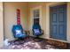 Inviting front porch with comfortable seating, perfect for enjoying the outdoors at 9317 Stone River Pl, Riverview, FL 33578