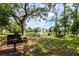 Relax in the park-like setting with picnic areas and barbecue grills near the pond at 9317 Stone River Pl, Riverview, FL 33578