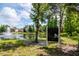 Relax at the picnic area by the pond with its fountain feature and lush landscaping at 9317 Stone River Pl, Riverview, FL 33578
