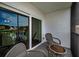 Cozy balcony area with glass doors, perfect for enjoying serene water views at 960 Virginia St # 204, Dunedin, FL 34698