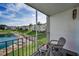 Relax on this screened balcony overlooking a landscaped lawn and tranquil lake at 960 Virginia St # 204, Dunedin, FL 34698