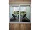 Balcony offers seating and a view of the lake and surrounding buildings at 960 Virginia St # 204, Dunedin, FL 34698