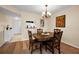 Dining area with wooden table, chairs, and hardwood floors at 960 Virginia St # 204, Dunedin, FL 34698