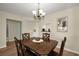 Dining area with wooden table, chairs, and hardwood floors at 960 Virginia St # 204, Dunedin, FL 34698