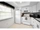 Well-lit kitchen equipped with modern appliances and ample cabinet space at 960 Virginia St # 204, Dunedin, FL 34698