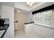 Kitchen nook with a small breakfast bar and window overlooking the exterior at 960 Virginia St # 204, Dunedin, FL 34698