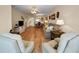 Spacious living room with hardwood floors and a view into the dining area at 960 Virginia St # 204, Dunedin, FL 34698