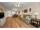 Comfortable living room showcases hardwood floors, neutral paint, and ample seating at 960 Virginia St # 204, Dunedin, FL 34698