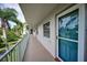 Hallway view with a teal front door at 960 Virginia St # 204, Dunedin, FL 34698
