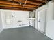 Unfinished basement with exposed wooden beams and utility connections at 3516 Norland Ct, Holiday, FL 34691
