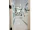Modern bathroom featuring marble accent wall, a white vanity, and new fixtures at 3516 Norland Ct, Holiday, FL 34691