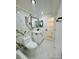 Updated bathroom featuring marble accent wall, modern fixtures and vanity at 3516 Norland Ct, Holiday, FL 34691