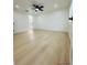 Bright and airy bedroom with modern flooring, recessed lighting, and access to an ensuite bathroom at 3516 Norland Ct, Holiday, FL 34691