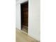 View of closet with sliding doors, showing built-in wooden shelving and ample storage space at 3516 Norland Ct, Holiday, FL 34691