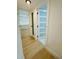 Hallway view showcasing modern doors and neutral walls, leading to bedroom at 3516 Norland Ct, Holiday, FL 34691