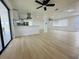 Open living space featuring recessed lighting, new flooring, and a modern kitchen with stainless steel appliances at 3516 Norland Ct, Holiday, FL 34691