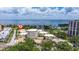 Attractive aerial view of waterfront condos surrounded by lush trees and gorgeous ocean backdrop at 1060 N Shore Ne Dr # 6, St Petersburg, FL 33701