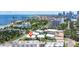 Aerial view of condos near the coast surrounded by lush trees with city skyline in the distance at 1060 N Shore Ne Dr # 6, St Petersburg, FL 33701