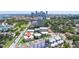 Aerial view of condos near the coast surrounded by lush trees with city skyline in the distance at 1060 N Shore Ne Dr # 6, St Petersburg, FL 33701