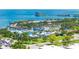 Overhead view of neighborhood swimming pool in desirable area with ocean views in the distance at 1060 N Shore Ne Dr # 6, St Petersburg, FL 33701