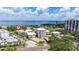 Beautiful aerial view of condos near the coast with lush trees, ocean view, and blue skies at 1060 N Shore Ne Dr # 6, St Petersburg, FL 33701