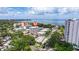 Scenic aerial view of beautiful condos featuring mature tree coverage and calm waterfront views at 1060 N Shore Ne Dr # 6, St Petersburg, FL 33701
