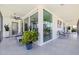 Large, tiled balcony with access to several rooms and views of the neighborhood at 1060 N Shore Ne Dr # 6, St Petersburg, FL 33701