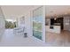 Balcony view into a modern kitchen with white cabinets and stainless steel appliances at 1060 N Shore Ne Dr # 6, St Petersburg, FL 33701