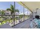 Balcony view featuring a nearby building and palm trees at 1060 N Shore Ne Dr # 6, St Petersburg, FL 33701