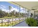 Screened balcony with fan offering expansive view of the lush tropical gardens at 1060 N Shore Ne Dr # 6, St Petersburg, FL 33701