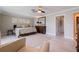 Bedroom with a ceiling fan, a king-sized bed, and light-colored floors at 1060 N Shore Ne Dr # 6, St Petersburg, FL 33701