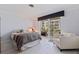 Bedroom with balcony access and light-colored wood flooring at 1060 N Shore Ne Dr # 6, St Petersburg, FL 33701