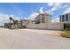 Exterior view of condo building featuring garage parking spaces, offering convenient and secure vehicle storage at 1060 N Shore Ne Dr # 6, St Petersburg, FL 33701