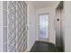 Hallway featuring security gate, glass-tiled doorway and elevator at 1060 N Shore Ne Dr # 6, St Petersburg, FL 33701