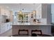 Bright eat-in kitchen featuring white cabinets, sleek countertops, and stainless steel appliances at 1060 N Shore Ne Dr # 6, St Petersburg, FL 33701