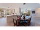 Bright kitchen and dining area featuring hardwood floors, white cabinets, and stainless steel appliances at 1060 N Shore Ne Dr # 6, St Petersburg, FL 33701