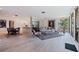 Bright open-concept living room featuring an attached dining area and access to the balcony at 1060 N Shore Ne Dr # 6, St Petersburg, FL 33701