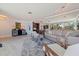Open concept living room with natural light, neutral color palette, and access to the dining area at 1060 N Shore Ne Dr # 6, St Petersburg, FL 33701