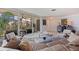 Living room with large sliders to the balcony offering natural light and garden view at 1060 N Shore Ne Dr # 6, St Petersburg, FL 33701