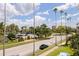 A beautiful view of the area with palm trees, buildings, and a partial view of a pool at 1060 N Shore Ne Dr # 6, St Petersburg, FL 33701