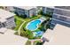 Overhead view of neighborhood pool surrounded by condos, landscaping, and walking paths at 1060 N Shore Ne Dr # 6, St Petersburg, FL 33701