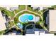 Overhead view of neighborhood pool surrounded by condos, landscaping, and walking paths at 1060 N Shore Ne Dr # 6, St Petersburg, FL 33701