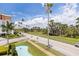 Beautiful street view with palm trees, blue skies, and a decorative pool enhancing the property's appeal at 1060 N Shore Ne Dr # 6, St Petersburg, FL 33701
