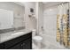 Bathroom featuring a granite countertop, a shower with tub, and neutral paint at 11464 Chilly Water Ct, Riverview, FL 33569