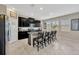 Modern kitchen with granite countertops, stainless steel appliances, and a convenient center island at 11464 Chilly Water Ct, Riverview, FL 33569