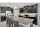Spacious kitchen with granite counters, stainless steel appliances, and a large center island with seating at 11464 Chilly Water Ct, Riverview, FL 33569